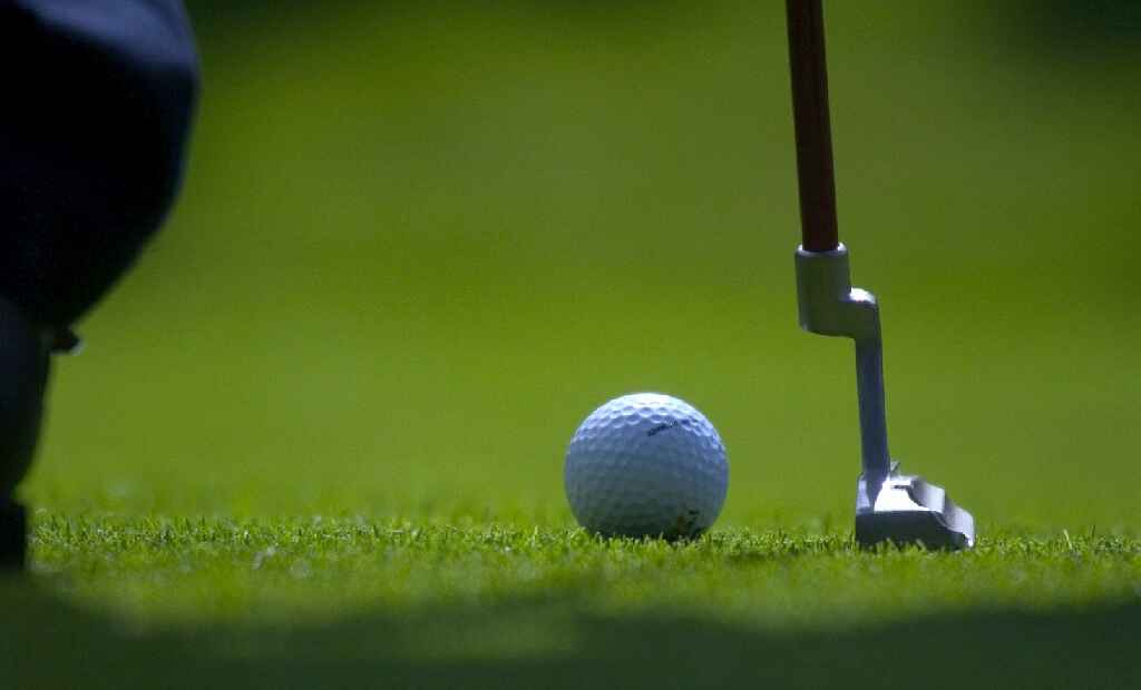 image of golf stick and ball on ground bigsun